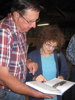 State Senator Robert Erberle sharing his book with Dr. Ute Schmidt at the Lehr Tabernacle, Lehr, ND, on 17 July 2012. Robert’s ancestral village is Teplitz, Bessarabia.