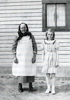 Hertha Bieber Lutz, age ten, with her grandmother, Fredericka Huber Bieber, age seventy-five, in front of the farmhouse east of Hosmer, South Dakota, 1939. (Photo courtesy of Hertha Bieber Lutz)