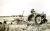 Eldena Becker on the tractor in 1944 or 1945 assisting with the field work.	