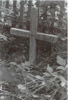 Instead of the marble gravestone - now a plain wooden cross from everybody. (page 96 in book)
