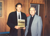 Peter Hilkes is presented the book, Prairie Mosaic by Rev. William C. Sherman while visiting Grand Forks, ND, October 1993.