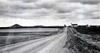 Distant view of Holy Trinity Catholic Church, Krasna area, Emmons County, North Dakota, 1976, by Fred Schumacher, Dakota Photo Documentary Project, State Historical Society of North Dakota.