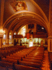 Arches in the Romanesque-style Sts. Peter and Paul Church, Strasburg, lead the eye heavenward, where paintings of biblical scenes deck the vaulted ceiling. The church, its historical decor still intact, is on the National Register of Historic Places.