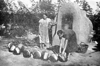 Baking bread during the summer using the outdoor oven in the village of Bad Burnas, Bessarabia.