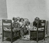 Nice Day: It was so nice outdoors that students were allowed to move their desks outside. Violet (Haid) Ohlhauser was the teacher at Omio School, Emmons County. Circa 1950s.