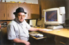 Dan Wipf sits in his office where he uses a powerful computer to design custom roof and floor trusses at the Willowbank Hutterite Colony, Edgeley, ND.