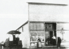 J.C. Bender Store. In front are Julius Bender and Fred Werre and child is Elmber Bender.